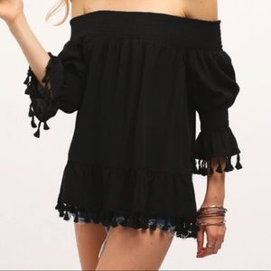 Black fringe off the shoulder top